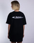 "Natzen" silverreflex oversized T-Shirt für Raver in schwarz, von Technostoff Streetwear, getragen von einer Frau, fotografiert von hinten
